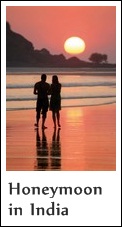 A couple strolling a beach in India