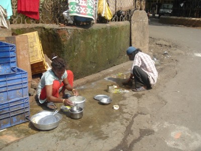 People washing the streets in Mumbai