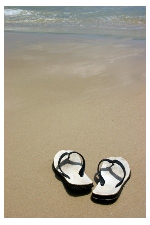 Sandals on a beach, ©iStockphoto.com/David Freund